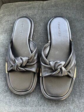 New black leather Coach slides, size 8 1/2